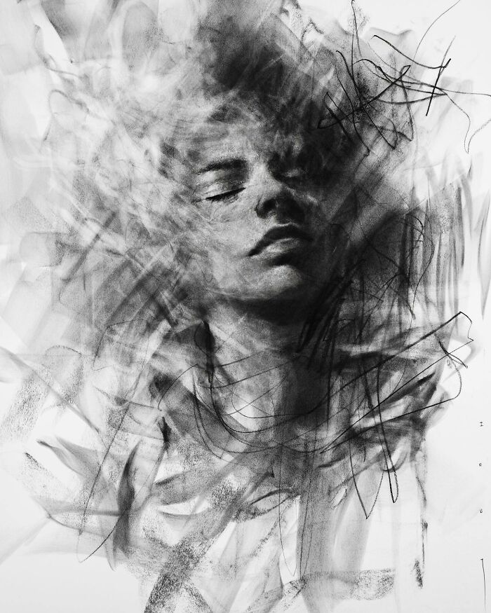 Charcoal portrait by Josh Hernandez, depicting a serene face emerging from abstract strokes.