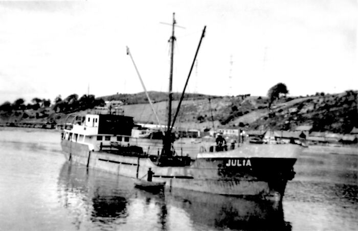 Black and white photo of a vintage ship named Julia on a river, illustrating jobs that fell by the wayside.