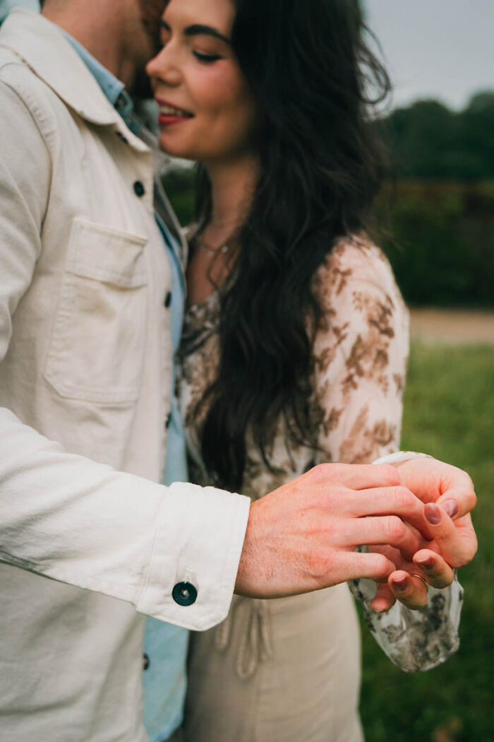 Close-up of a couple holding hands, showcasing one of the best wedding photographs.