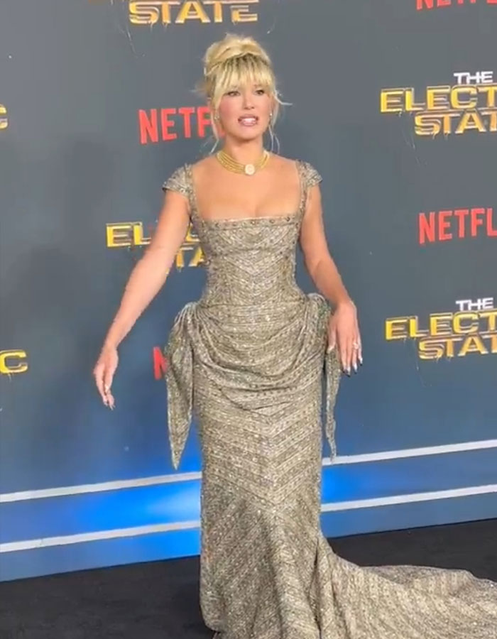 Millie Bobby Brown at "The Electric State" event, wearing an elegant gown. Millie Bobby Brown at "The Electric State" event, wearing an elegant gown.