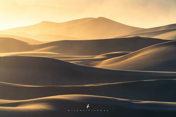 Intimate landscape photo of sand dunes at sunset, showcasing nature's textures and golden light by Michael Hindman.