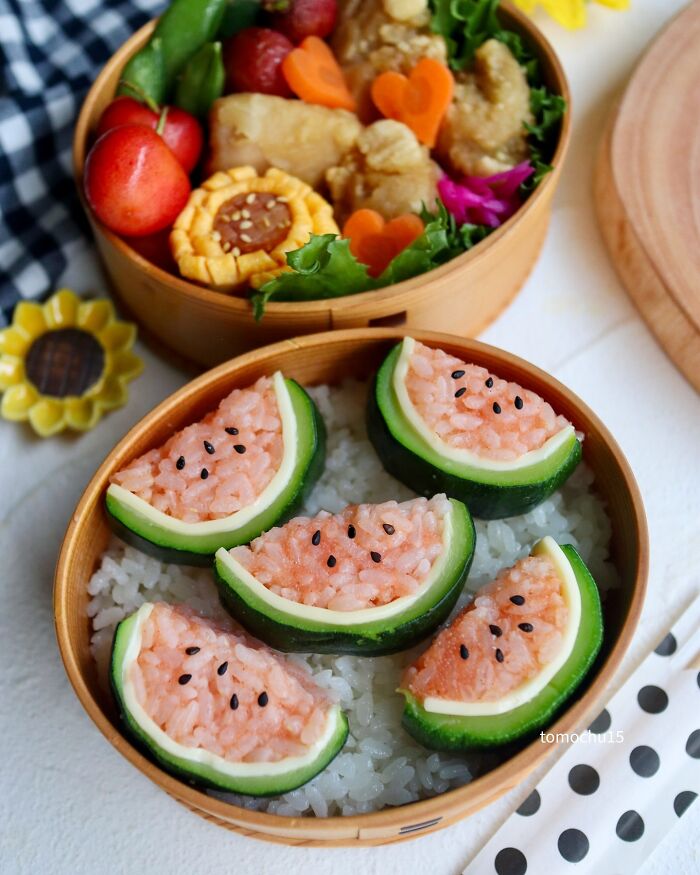 Creative lunchbox with artistic sushi shaped like watermelon slices, by a talented Japanese artist.