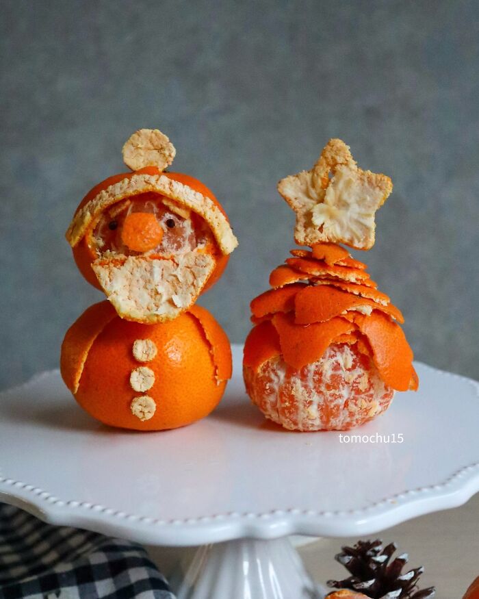 Creative lunchbox: Oranges sculpted into a Santa and a Christmas tree by a Japanese artist.