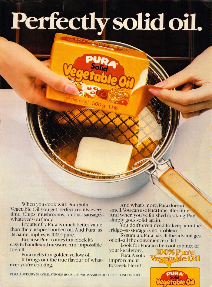 Hands holding Pura Solid Vegetable Oil over a frying pan, showcasing vintage-commercials appeal.