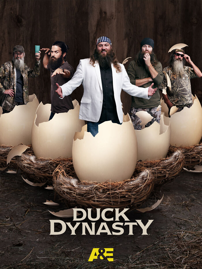 Cast of Duck Dynasty emerging from giant eggs, posed creatively against a rustic background.
