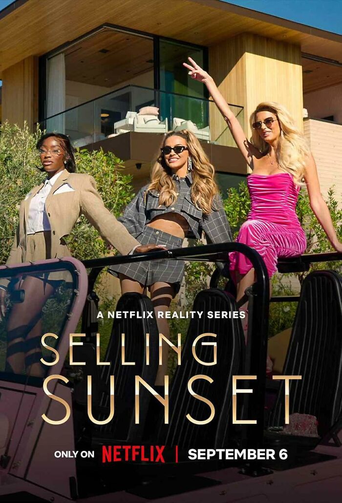 Reality TV show Selling Sunset cast posing in front of a modern house.