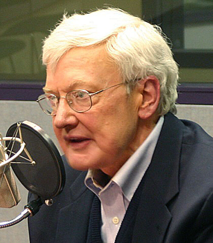 Man in a studio speaking into a microphone, possibly related to pop culture moments.