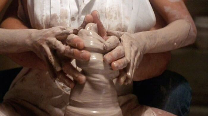 Hands shaping a clay pot, iconic scene from a well-known film, highlighting famous movie props.