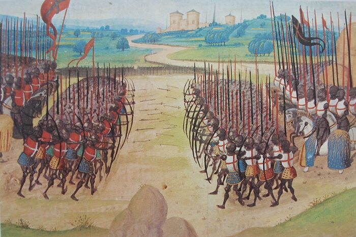 Medieval battle scene illustrating surprising war victories, with two opposing armies facing each other in a field.