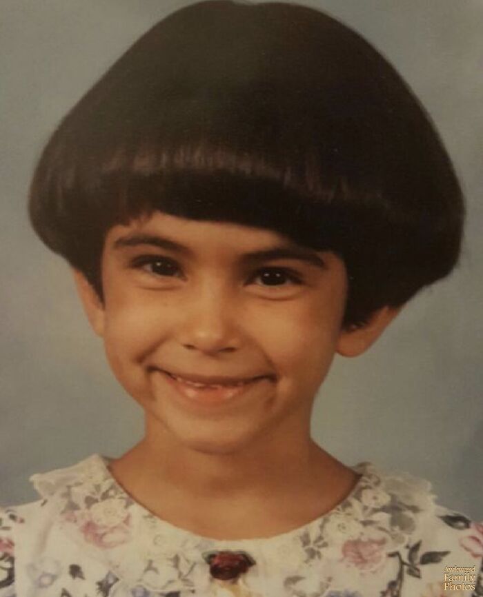Child with a bowl haircut smiling, showcasing an epic hair disaster from the 1980s and 1990s fashion trends.