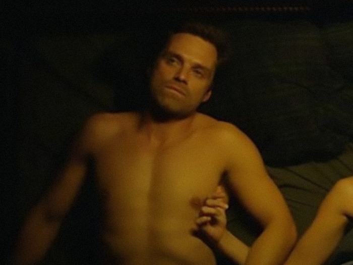 Sebastian Stan known for onscreen performances without prosthetics, lying on a bed.