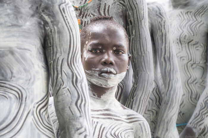 Ethiopian people with body paint in a captivating portrait by Daniel Kordan.