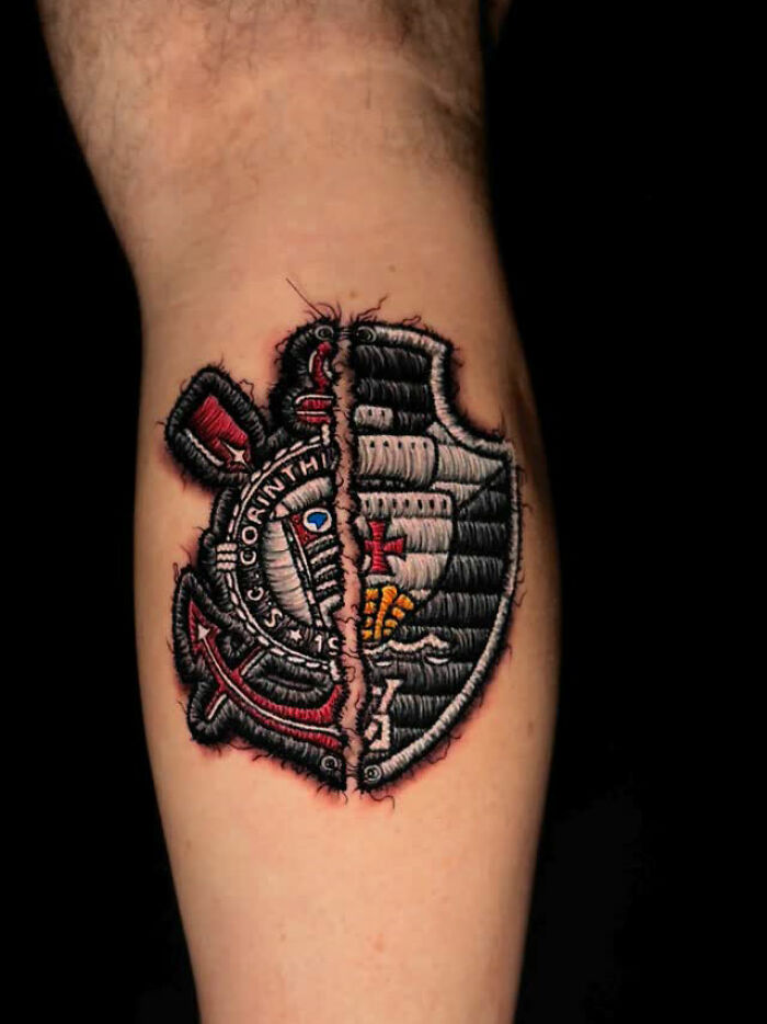 Realistic embroidery tattoo on a person's leg, showcasing intricate design and detailed stitching effect.