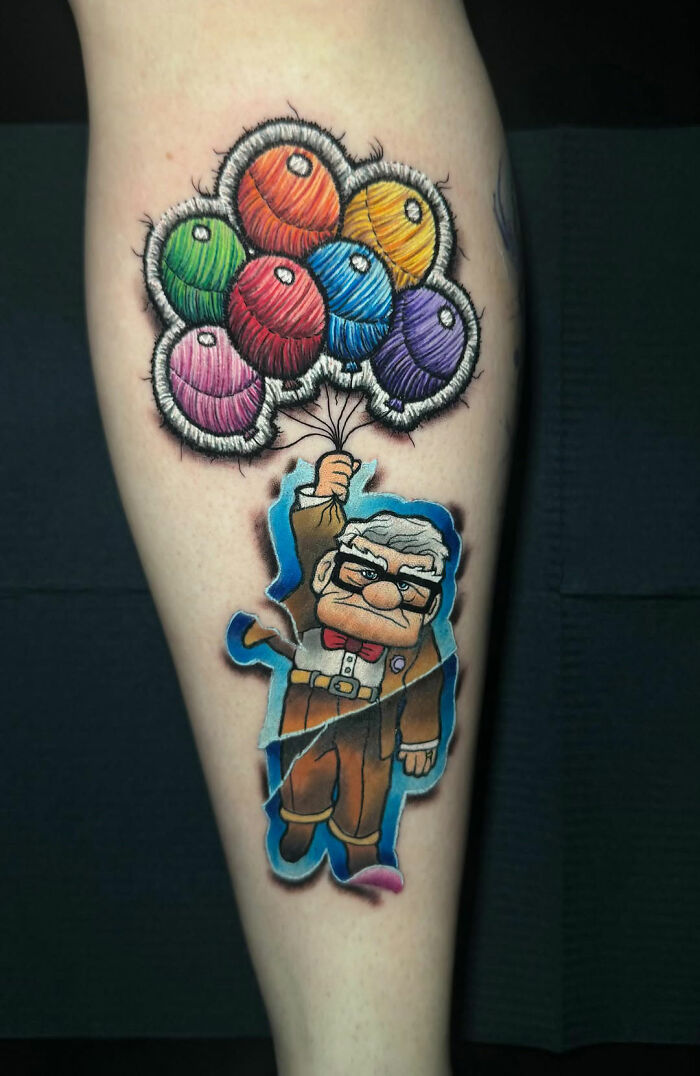 Realistic embroidery tattoo of an elderly man holding colorful balloon yarns, showcasing 3D stitching effect.