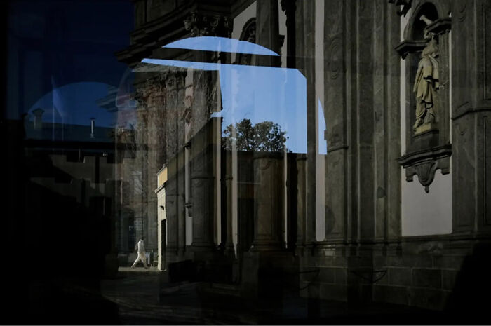 Abstract street photograph by Andrea Pozzoni featuring architectural details and contrasting shadows.