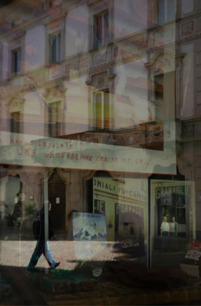 Abstract street photograph with layered reflections and buildings, by Andrea Pozzoni, creating a surreal urban scene.
