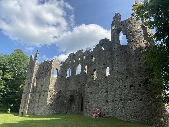 Ruined stone building under a blue sky, exemplifying beautiful useless buildings.