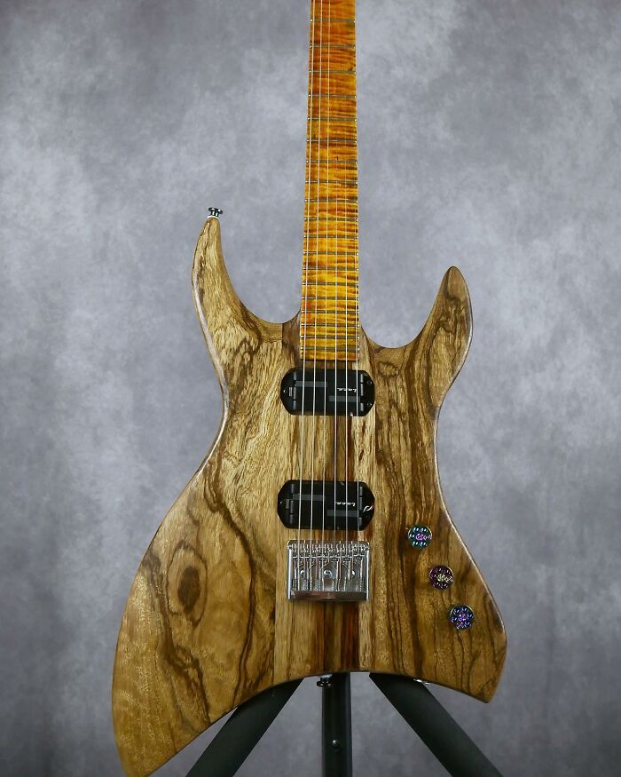 Stunning guitar crafted from unexpected materials, showcasing unique wood patterns.