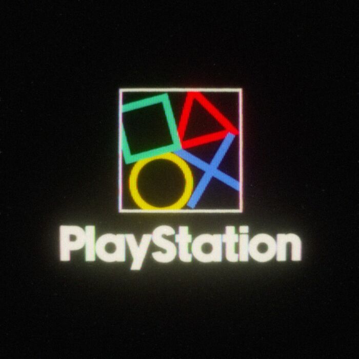 Retro 80s twist on modern PlayStation logo in colorful geometric design on black background.