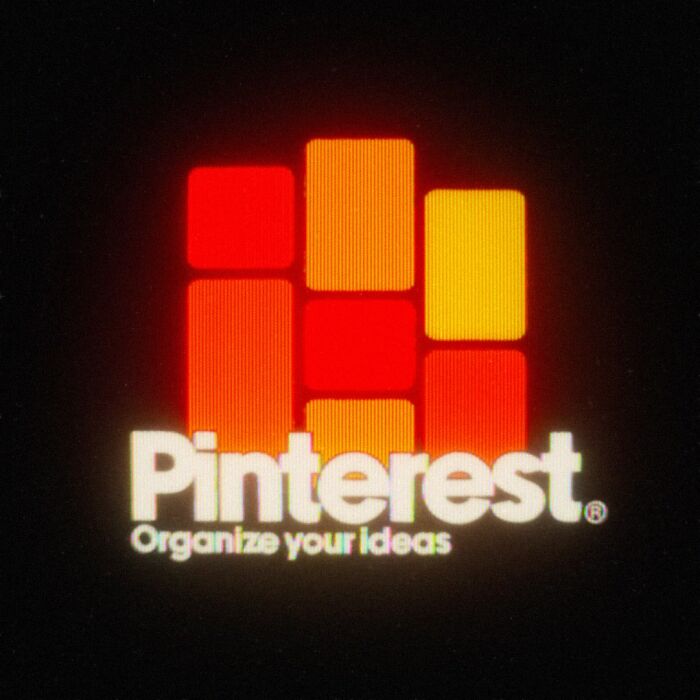 Retro 80s twist on Pinterest logo with vibrant red and orange blocks.