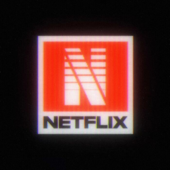 Retro 80s twist on modern Netflix logo with bold red and white design against a black background.