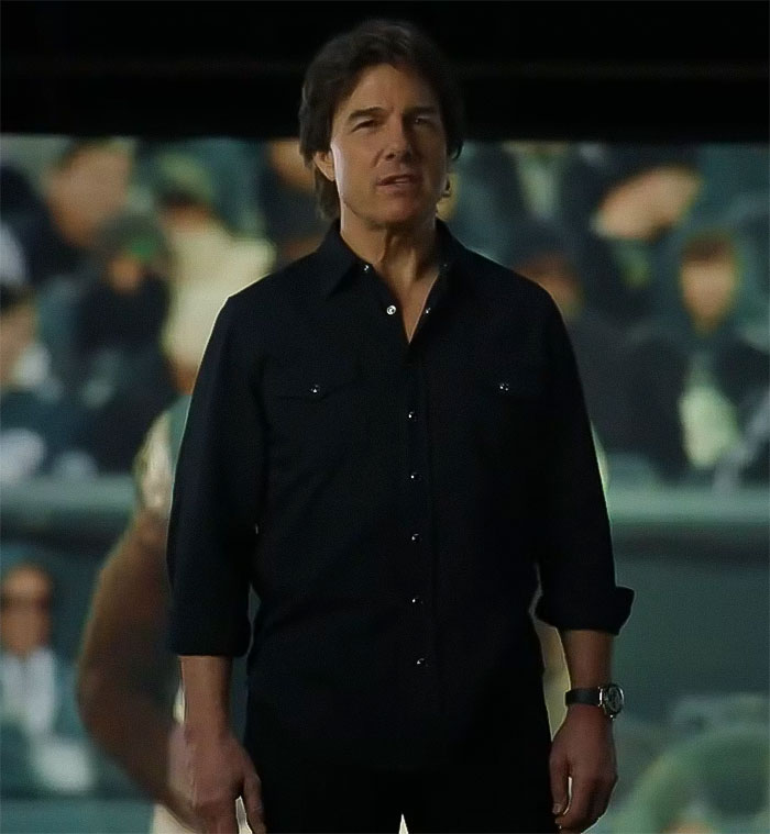 Actor in dark shirt during Super Bowl 2025 ad, sparking discussion about his appearance.