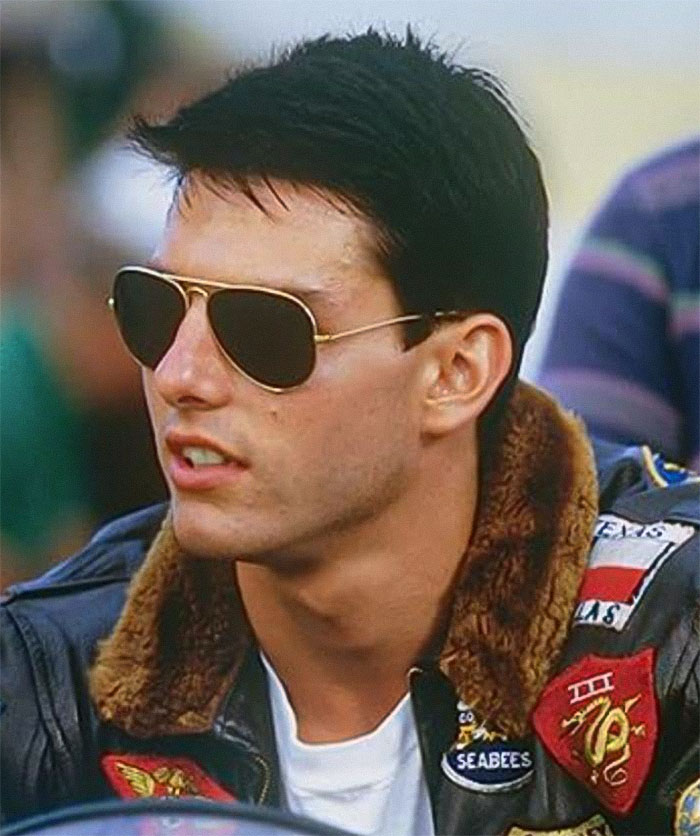 Actor wearing aviator sunglasses and a leather jacket with patches, sparking curiosity about recent appearances.