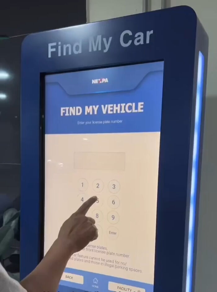 Person using a kiosk for finding a parked car, illustrating tourist interesting experiences with technology.