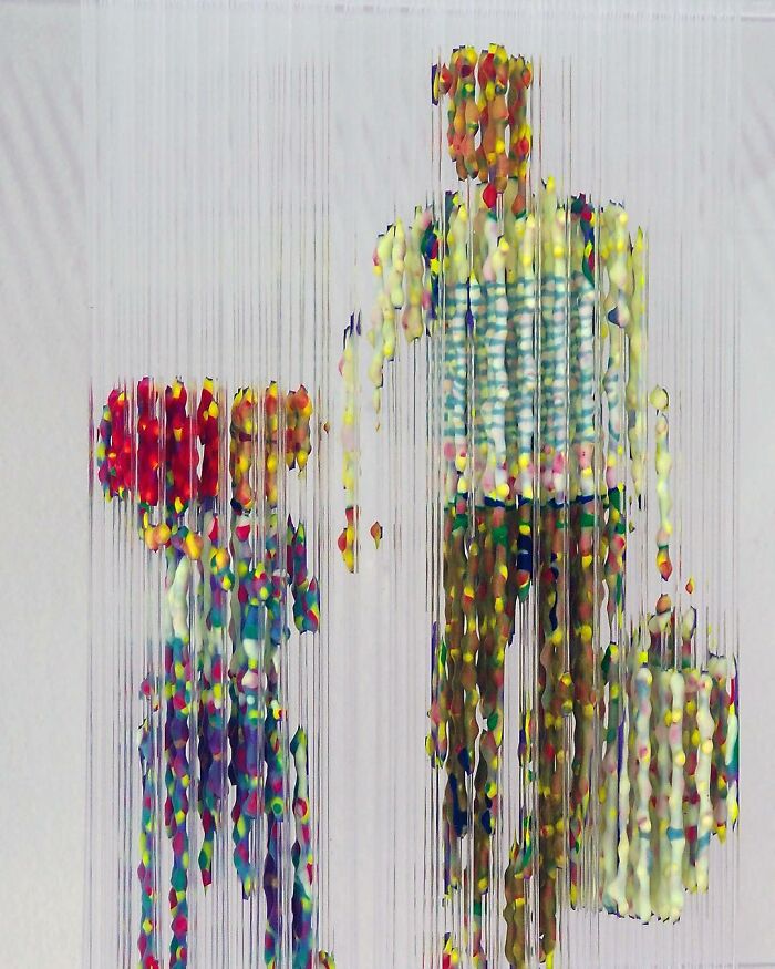 Three-dimensional, fragmented painting of people by Chris Dorosz with vibrant, suspended paint droplets.