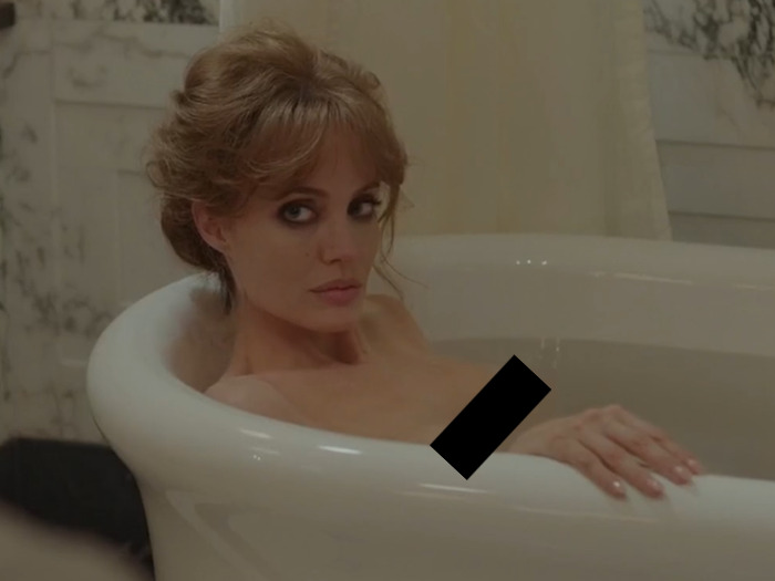 Angelina Jolie in a bathtub scene, opting for natural appearance without prosthetics.