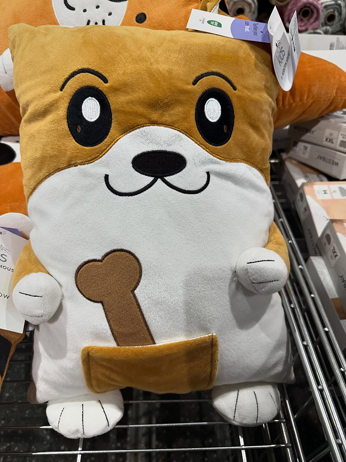 Toy photo goes viral for inappropriate design; plush dog with a bone illustration on its belly.