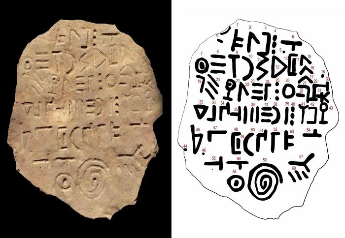 Ancient civilizations artifact with indecipherable script on a stone tablet.