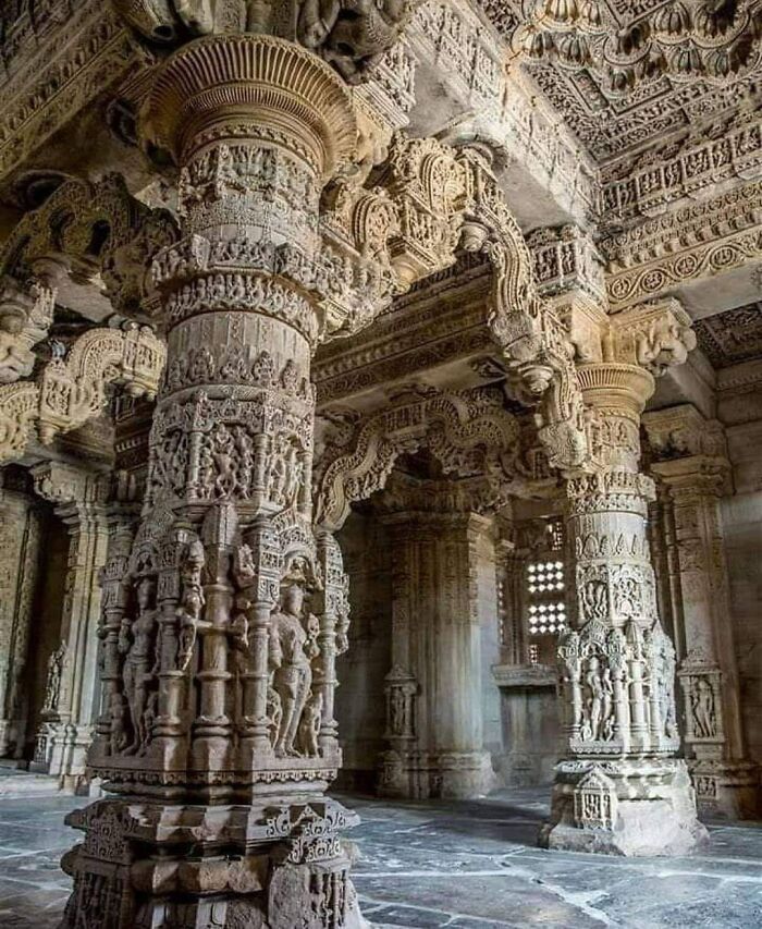 Intricately carved ancient temple columns showcasing artifacts of ancient civilizations.
