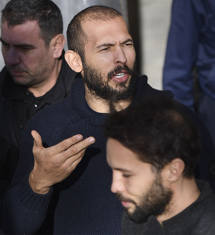 Man in a dark sweater gesturing emphatically, related to Andrew Tate comment on Ariana Grande's body discussion. Man in a dark sweater gesturing emphatically, related to Andrew Tate comment on Ariana Grande's body discussion.