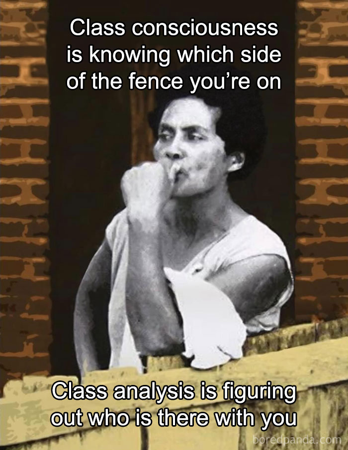 Person leaning on fence with text about class consciousness and analysis, highlighting anti-capitalism themes.