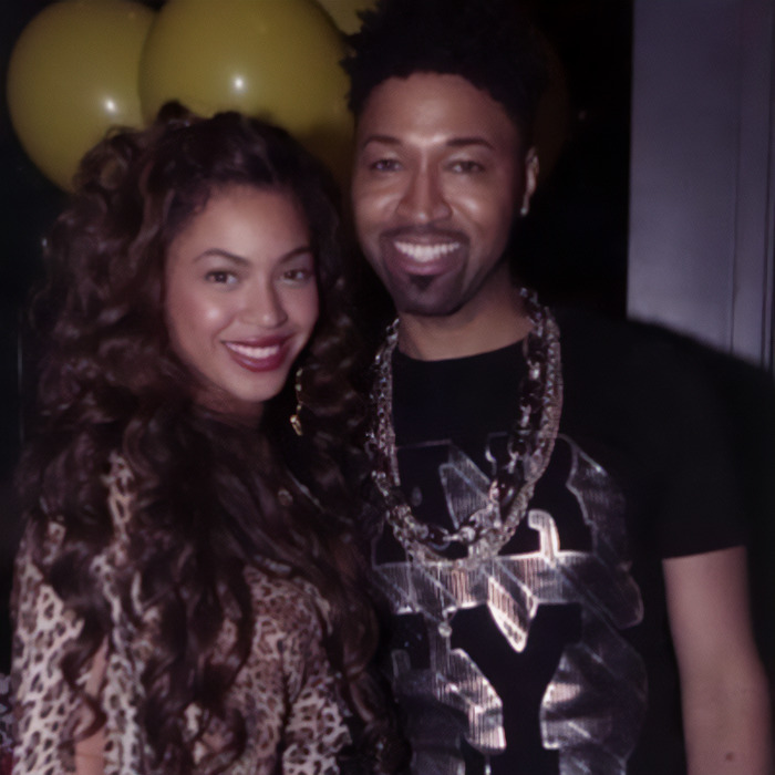 A smiling woman and a man posing together, related to Beyoncé's stylist and wardrobe topic. A smiling woman and a man posing together, related to Beyoncé's stylist and wardrobe topic.