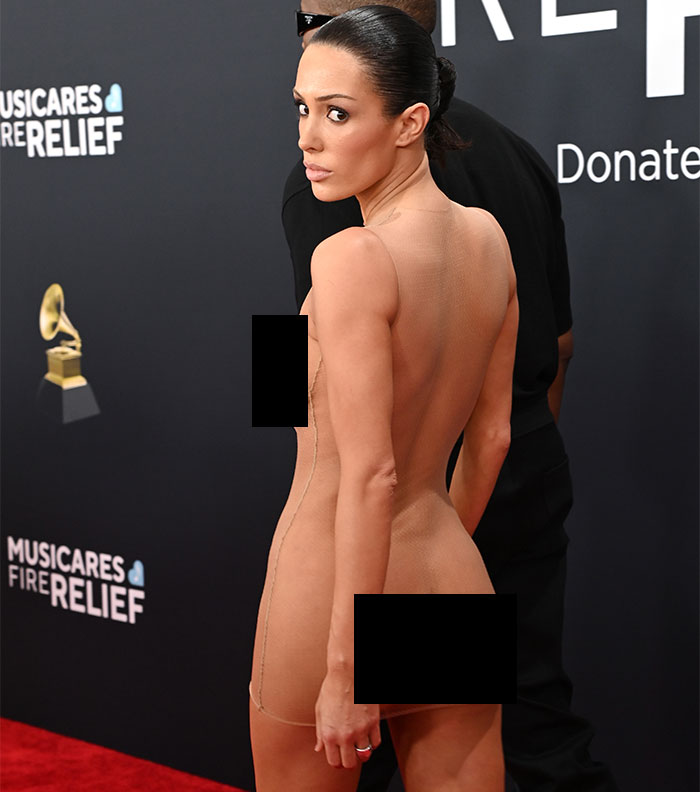 Bianca Censori in a daring outfit on the Grammys red carpet, garnering attention. Bianca Censori in a daring outfit on the Grammys red carpet, garnering attention.
