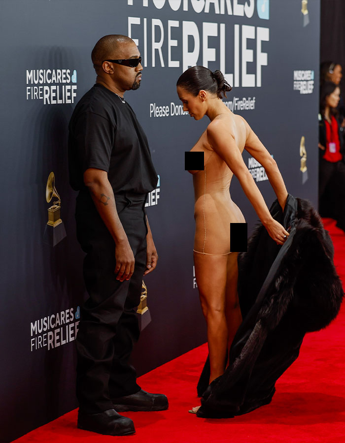 Bianca Censori in a revealing outfit with Kanye West at the 2025 Grammys red carpet event. Bianca Censori in a revealing outfit with Kanye West at the 2025 Grammys red carpet event.