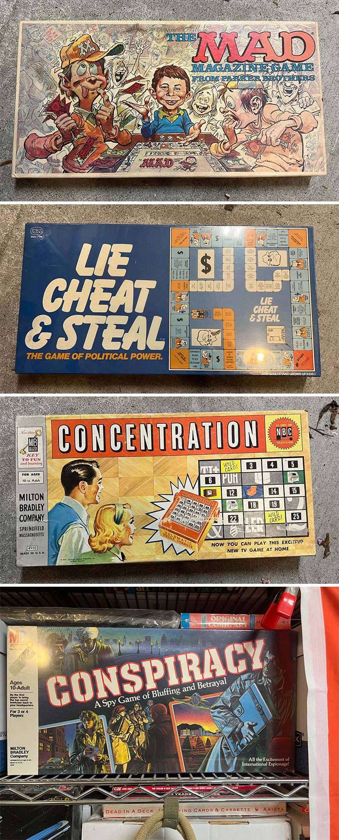 Vintage toys including The Mad Magazine Game, Lie Cheat & Steal, Concentration, and Conspiracy board games displayed.
