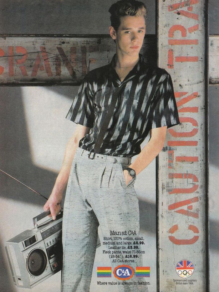 Young man in striped shirt holding a boombox in a vintage-commercial advertisement for C&A fashion, leaning against a wooden wall.