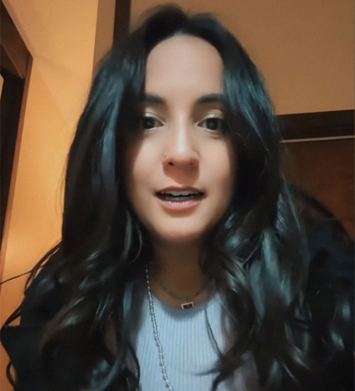 Woman discovers disturbing truth about her adoption while raised by a Mormon family, looking surprised.