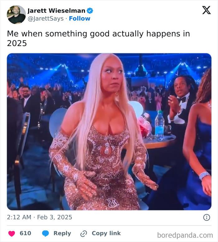 Person in sparkling dress reacts during 2025 Grammys, surrounded by attendees in formal attire.