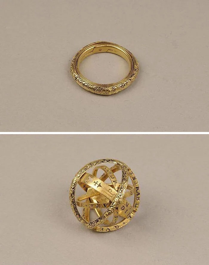 Cool old things: a gold astronomical ring that unfolds into a spherical armillary design on a neutral background.