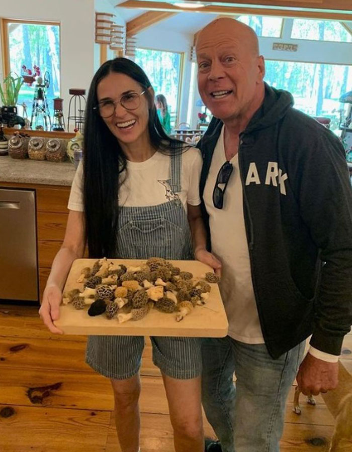 Demi Moore holding mushrooms in a kitchen, sharing an update on Bruce Willis' dementia battle. Demi Moore holding mushrooms in a kitchen, sharing an update on Bruce Willis' dementia battle.
