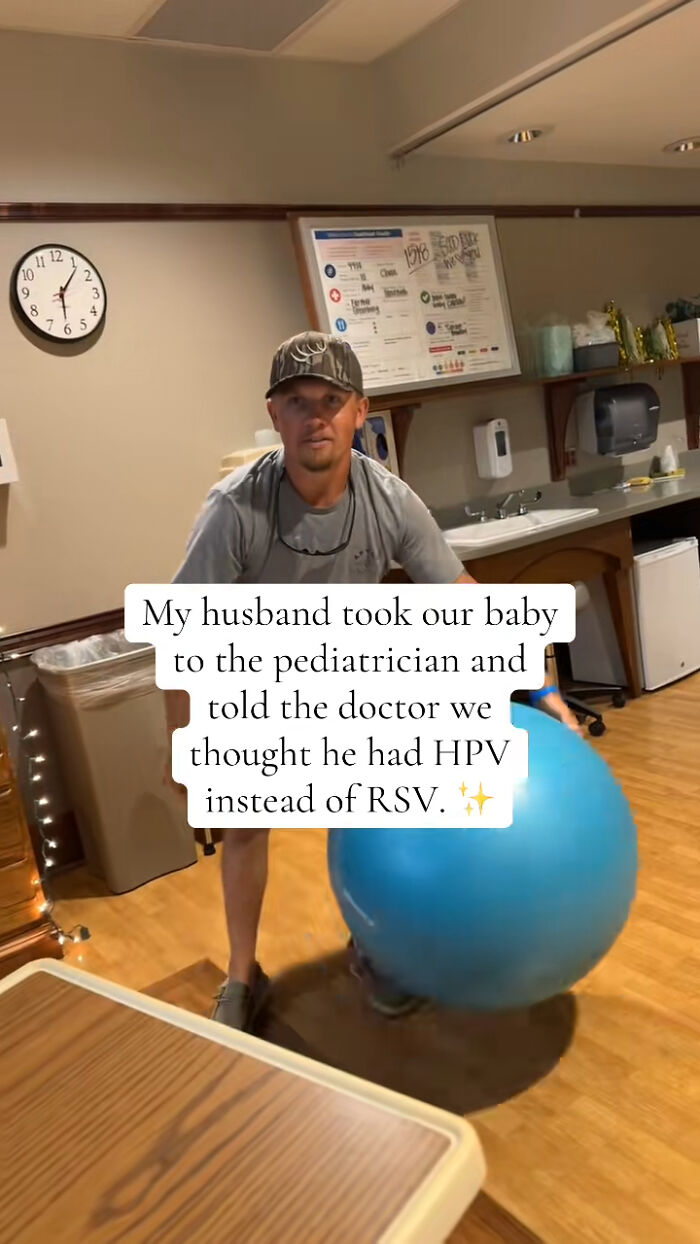 Man in a cap holding a blue exercise ball in a room, illustrating a humorous crisis moment.