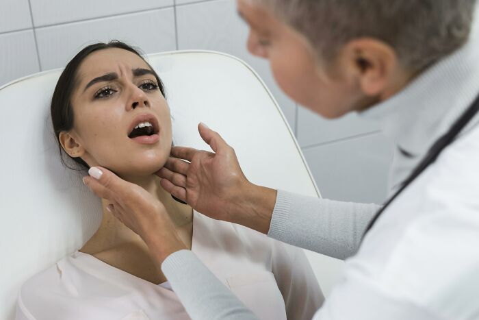 Patient examined by a professional, showcasing rare and unusual cosmetic procedures.