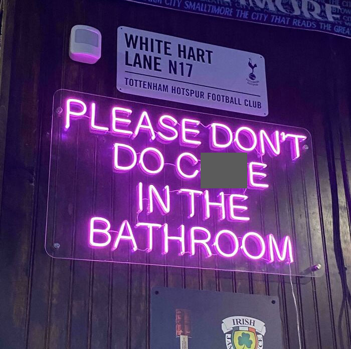 Neon sign humor in a bar, reflecting wild Florida moments.