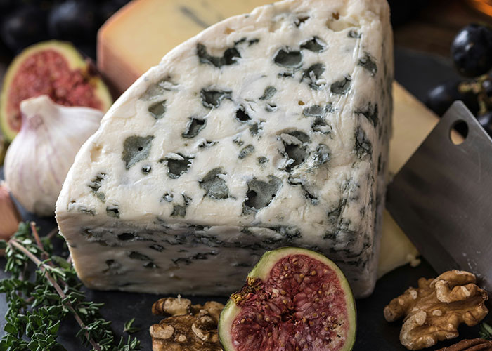 Blue cheese with figs, garlic, and walnuts, a food people start loving as they grow up.