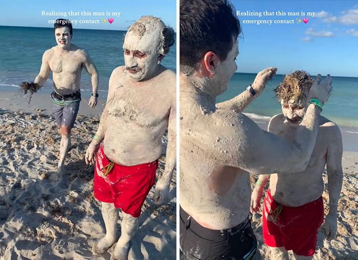 Two men covered in sand jokingly styled, on a beach with "emergency contact" text overlay.