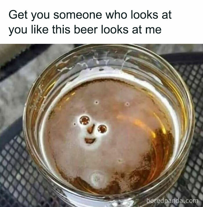 Beer with bubbles forming a smiling face, showcasing funny internet meme humor.